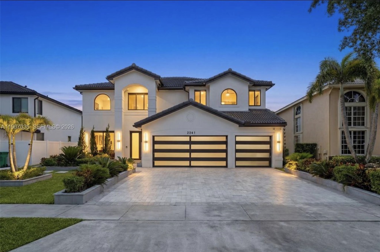 Featured residential project exterior at dusk
